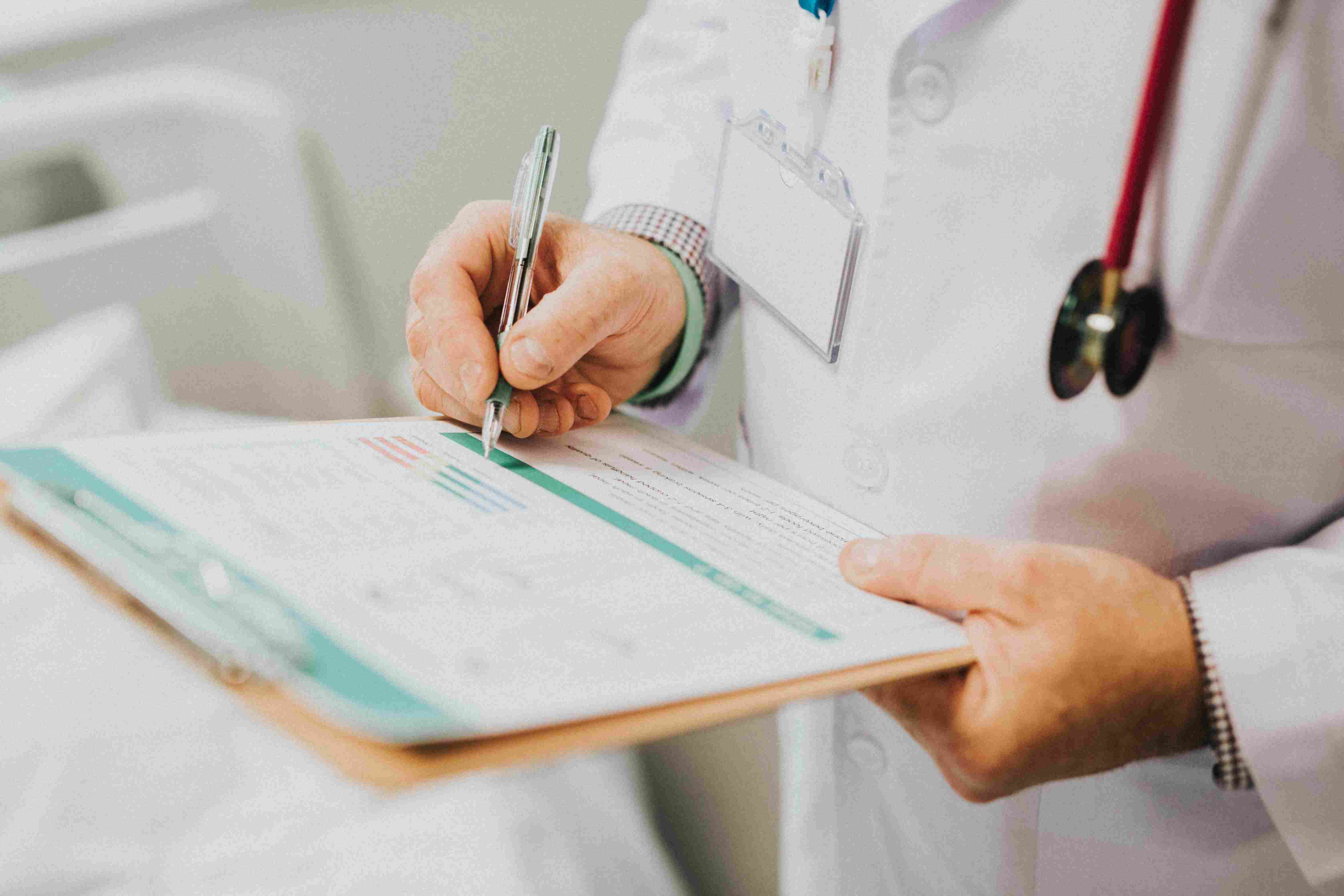 Man conducting health assessment and audit